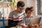 Dad and daughter using computer together at home.