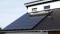 Bilden visar en solcellsanläggning på taket för elproduktion, till exempel för att driva ett värmesystem.